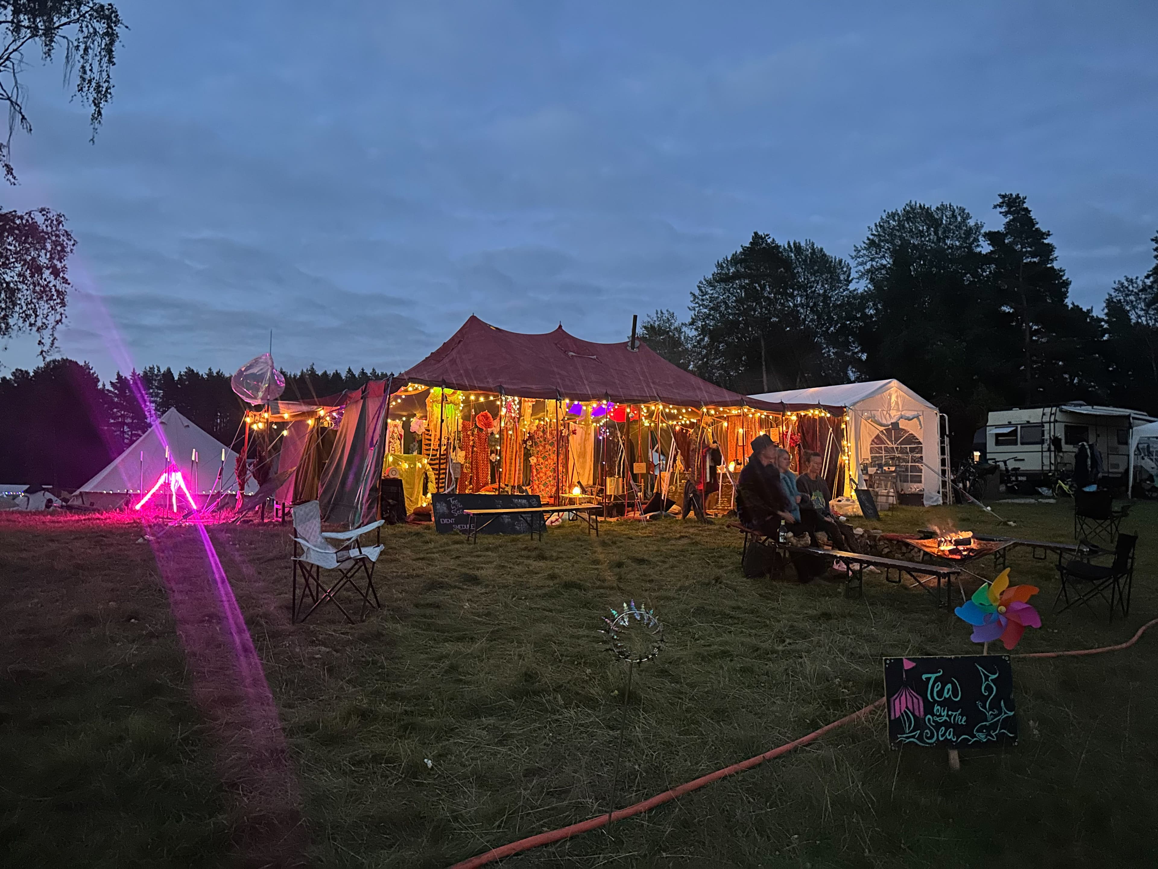 Outside the tent with the fireplace at night